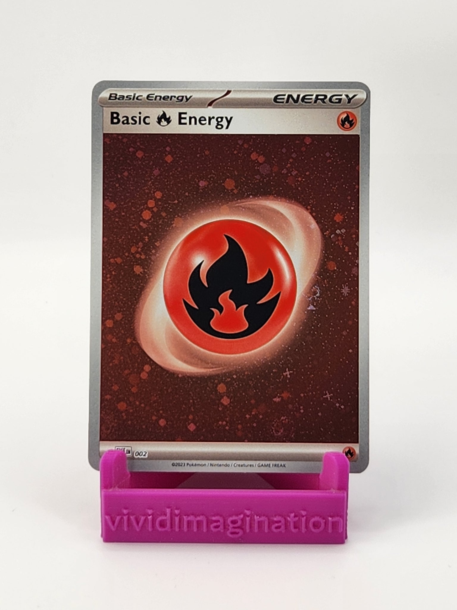 Basic Fire Energy 002 (Cosmos Holo) - All the best items from Vivid Imagination Cards and Collectibles - Just $0.39! Shop now at Vivid Imagination Cards and Collectibles